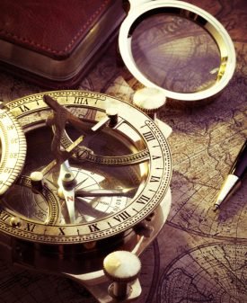 old-vintage-compass-travel-instruments-ancient-map